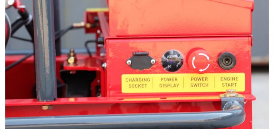 Control panel with charging socket, power display, power switch, and engine start